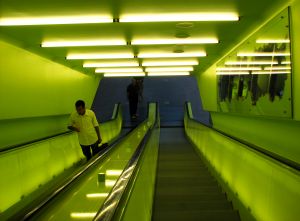 872473_man_on_neon_escalator.jpg